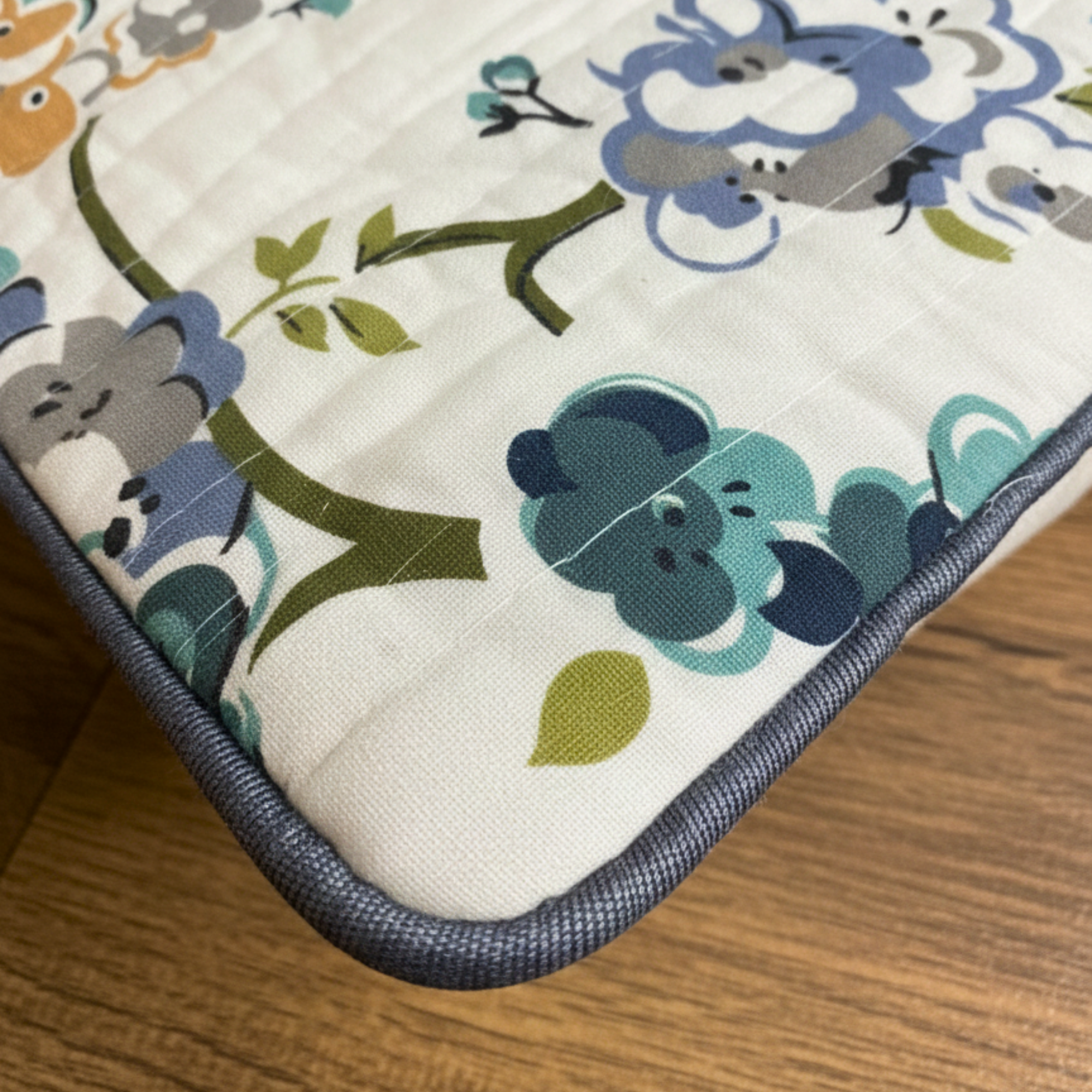 QUILTED FLORAL CUSHION COVER